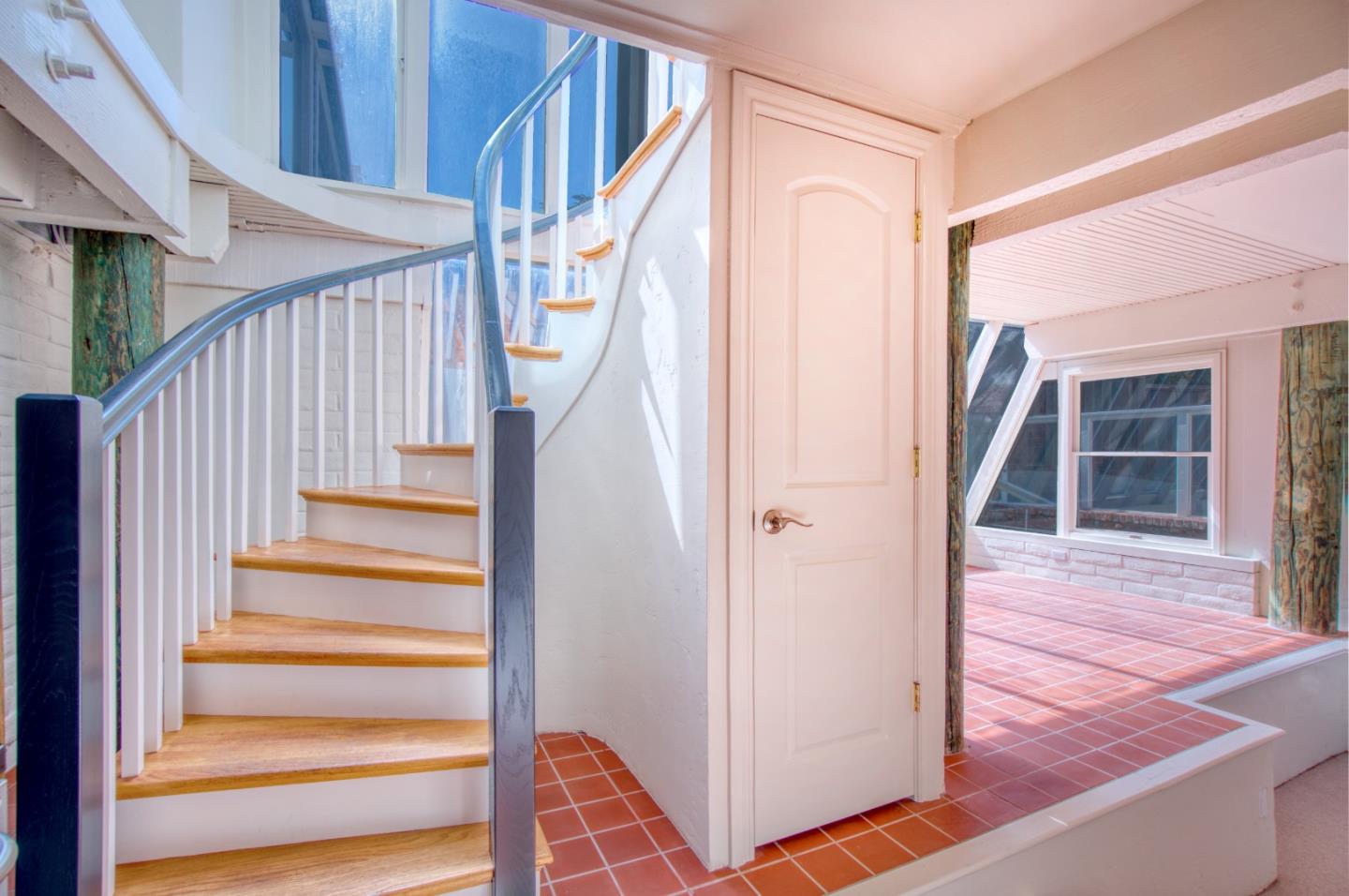191 Reef Point Road Moss Beach, CA 94038 - Photo 20 of 41 a view of entryway with wooden floor and stairs