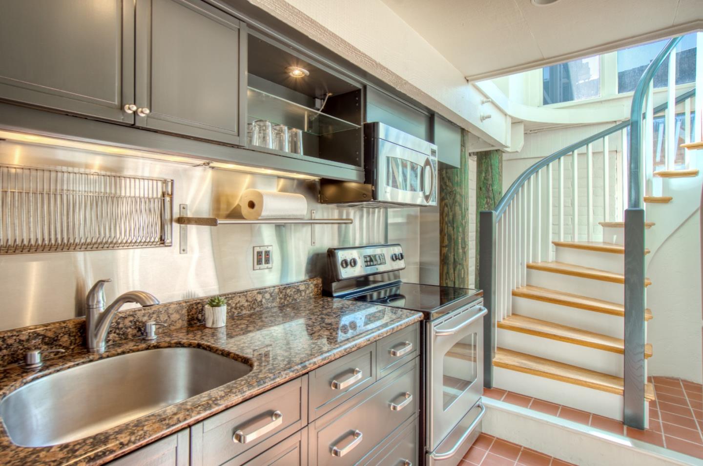 191 Reef Point Road Moss Beach, CA 94038 - Photo 21 of 41 a kitchen with stainless steel appliances granite countertop a sink and cabinets