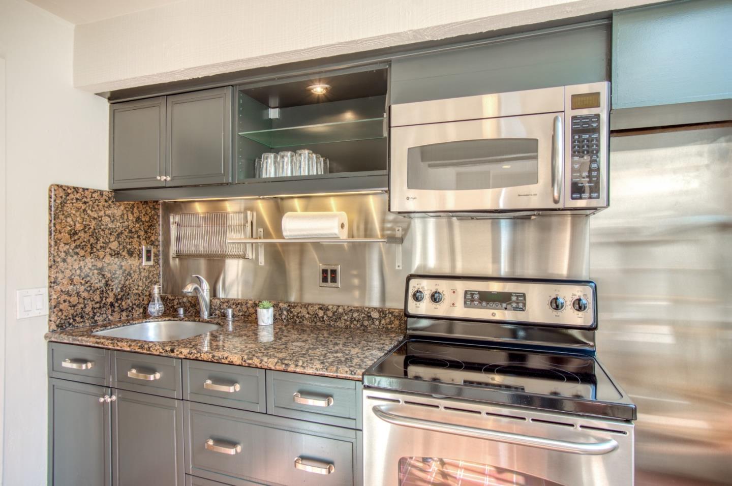 191 Reef Point Road Moss Beach, CA 94038 - Photo 22 of 41 a kitchen with appliances and cabinets