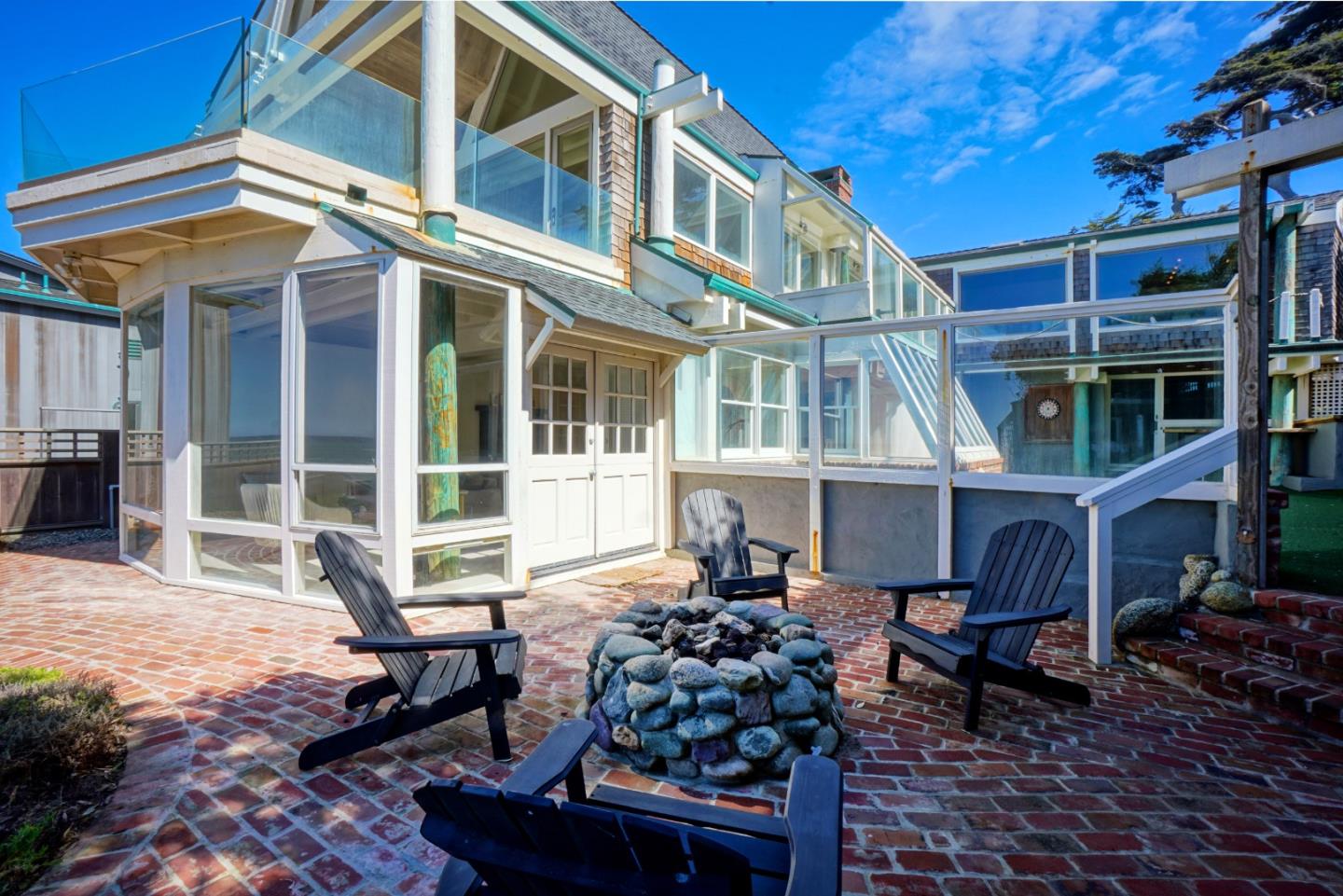 191 Reef Point Road Moss Beach, CA 94038 - Photo 35 of 41 a view of a brick house with many windows