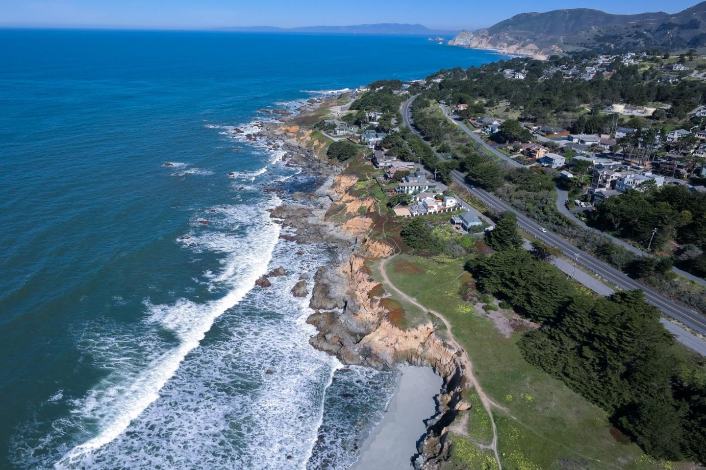 191 Reef Point Road Moss Beach, CA 94038 - Photo 37 of 41 a view of a city with an ocean