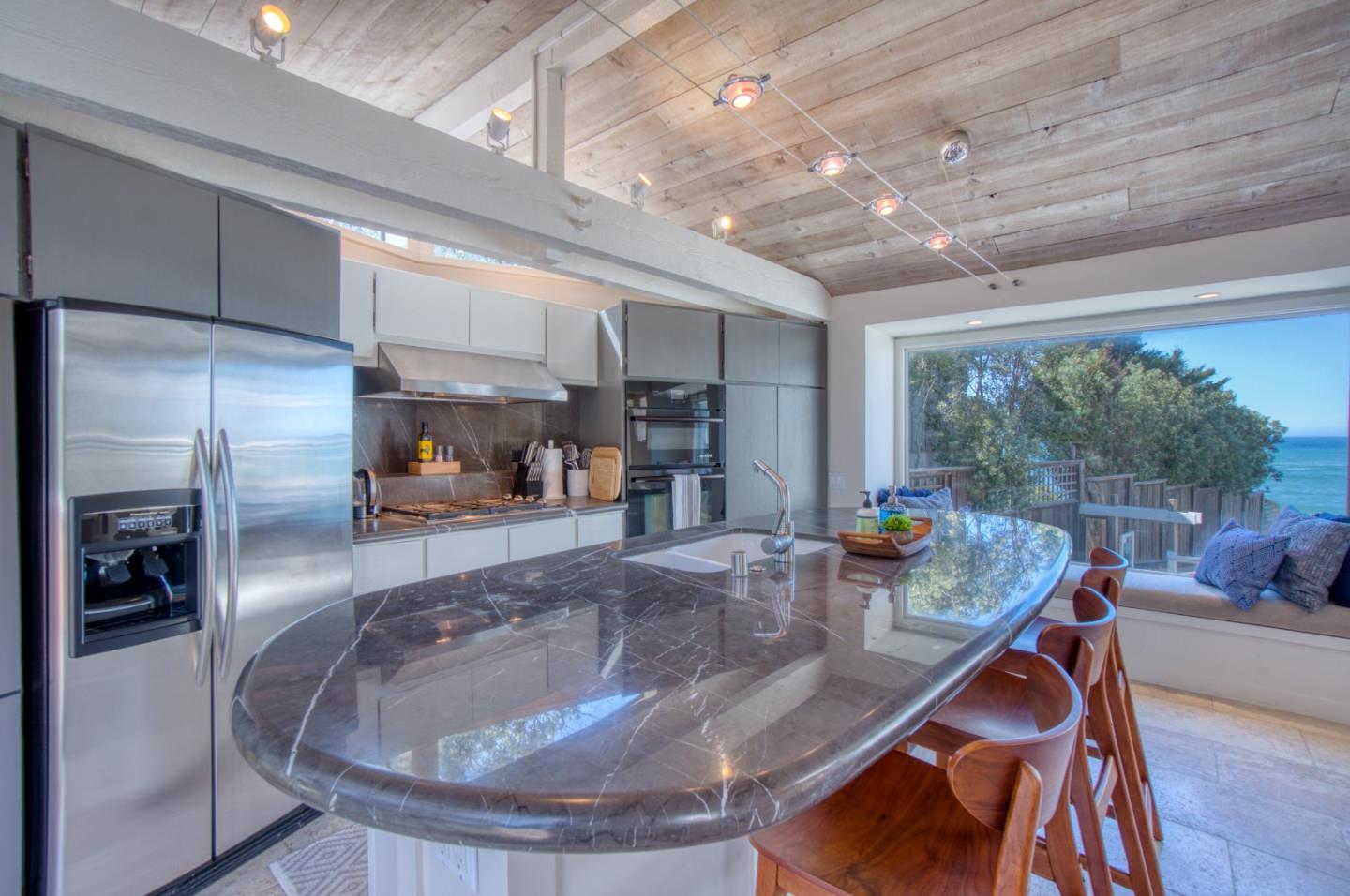 191 Reef Point Road Moss Beach, CA 94038 - Photo 6 of 41 a view of a living room and kitchen