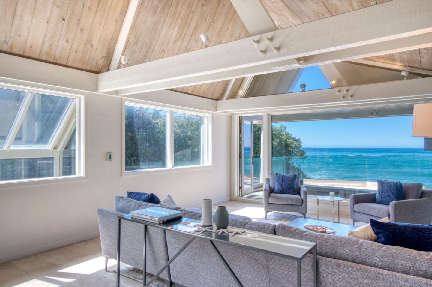 191 Reef Point Road Moss Beach, CA 94038 - Photo 10 of 41 a living room with furniture and windows