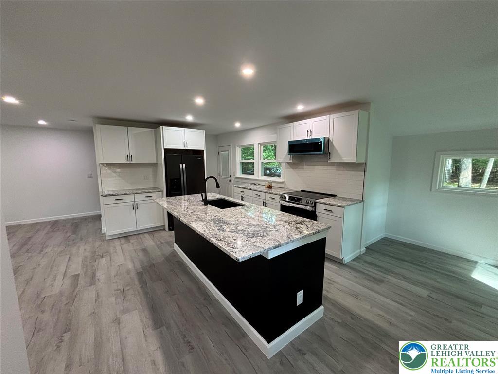 250 Bird Lane Kunkletown, PA 18058 - Photo 7 of 40 a kitchen with a stove and a sink