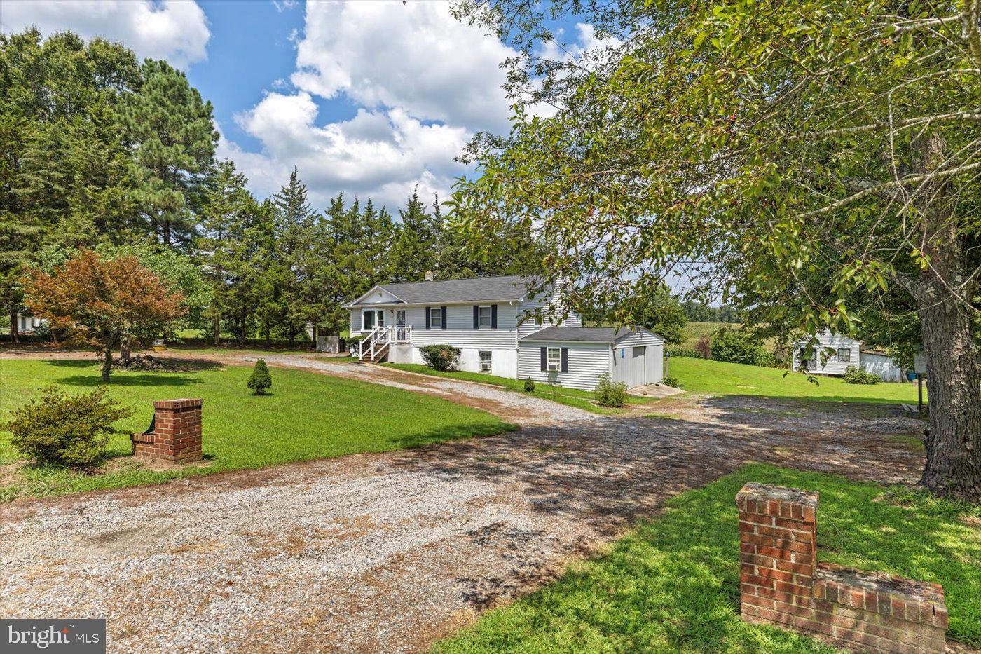 Exterior Photo with wrap around gravel driveway