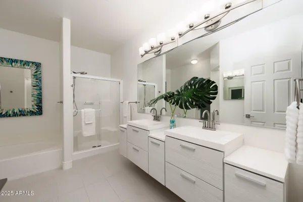 a bathroom with a sink a faucet a mirror and a bathtub
