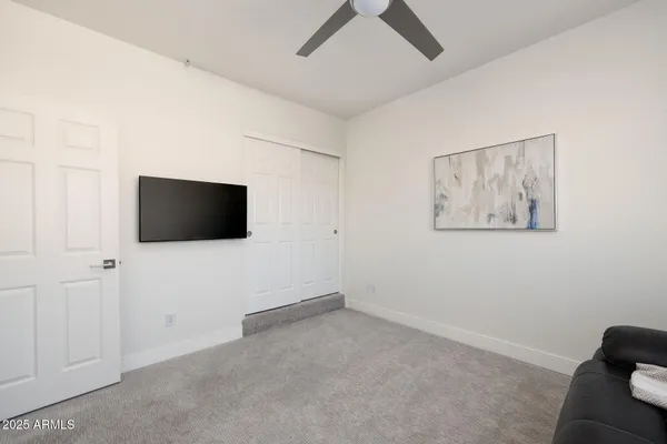 a living room with a flat screen tv