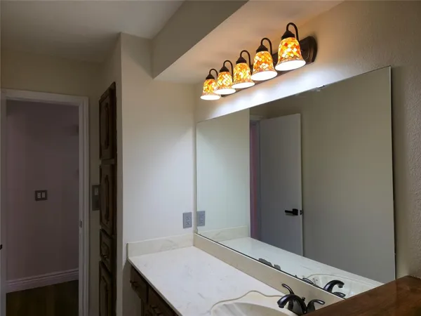 a bedroom with a bed and a table