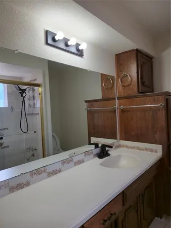 a bathroom with a sink and mirror