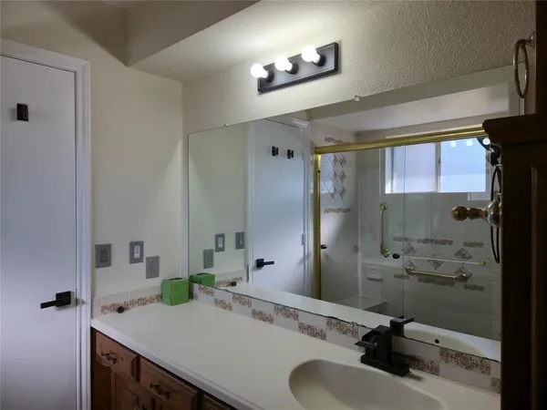 a bathroom with a sink and a mirror