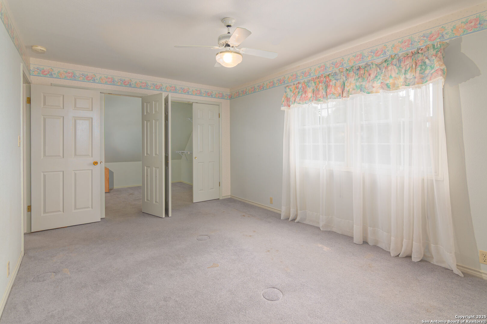 2981 Vivroux Ranch Road Seguin, TX 78155 - Photo 38 of 50 an empty room with a ceiling fan and a window