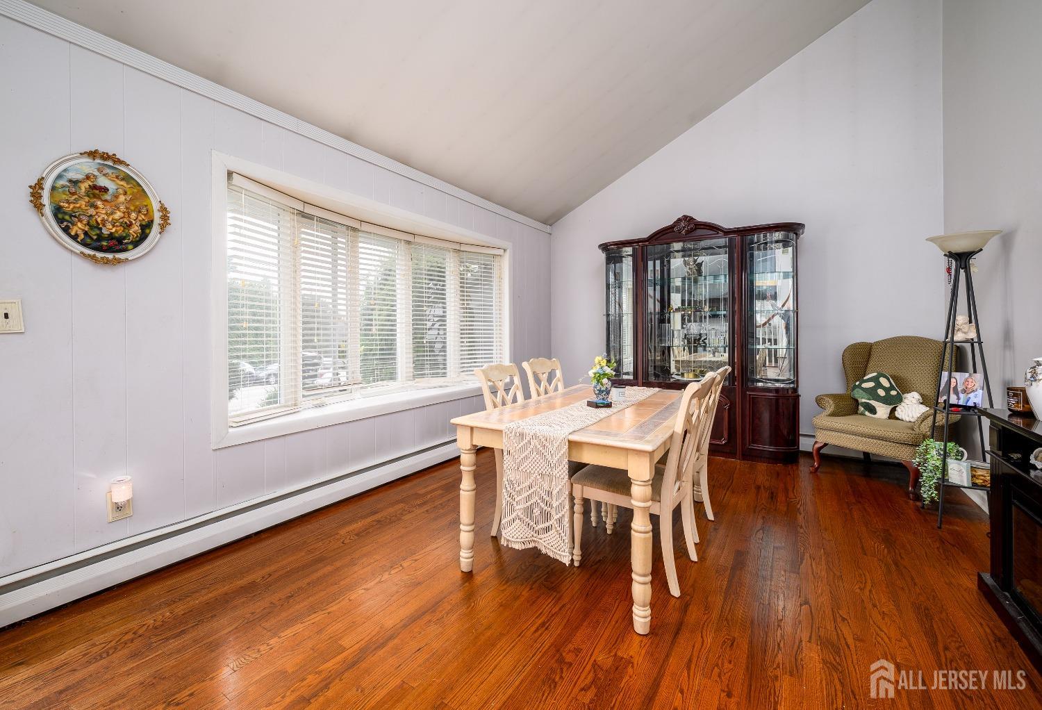 109 Hickory Road Colonia, NJ 07067 - Photo 14 of 34 a dining room with furniture entryway and wooden floor