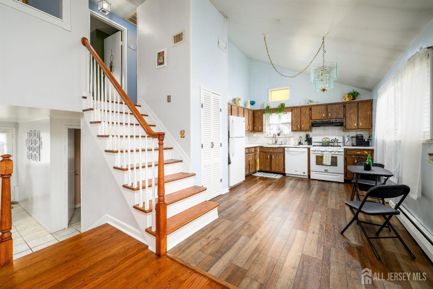 109 Hickory Road Colonia, NJ 07067 - Photo 15 of 34 a view of a kitchen with furniture and wooden floor