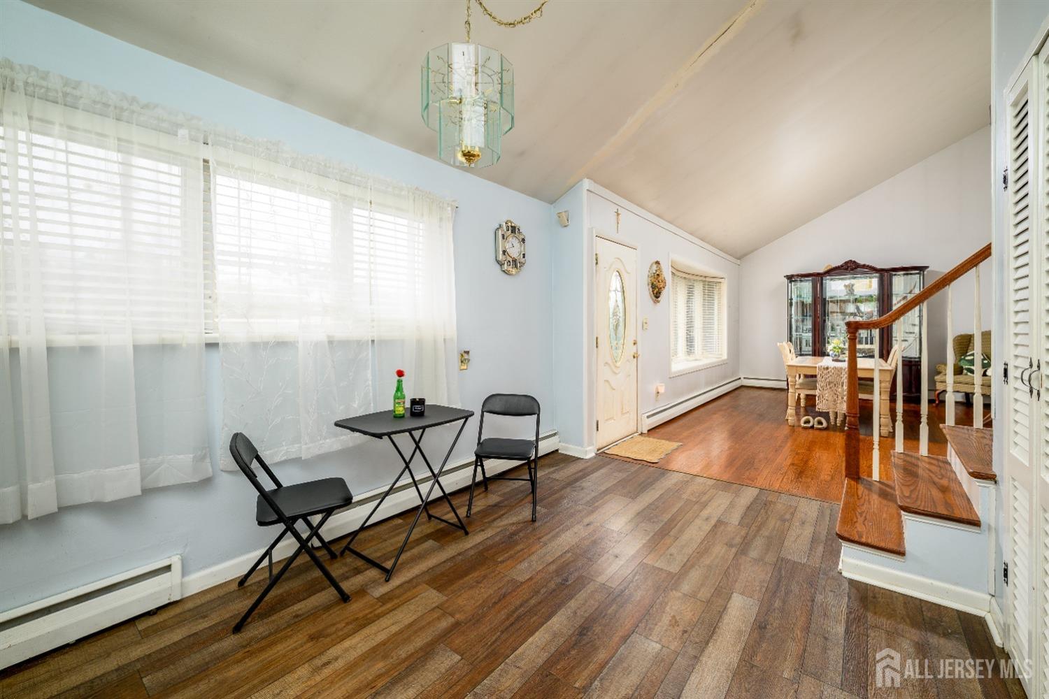109 Hickory Road Colonia, NJ 07067 - Photo 17 of 34 a living room with furniture and a wooden floor
