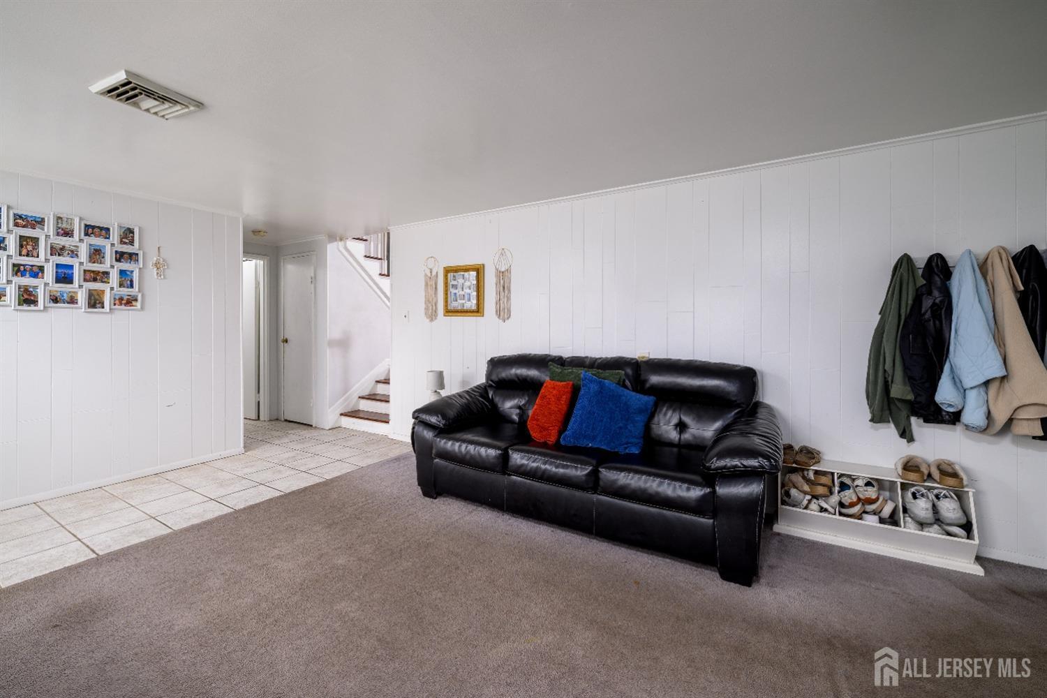 109 Hickory Road Colonia, NJ 07067 - Photo 21 of 34 a living room with furniture and a flat screen tv