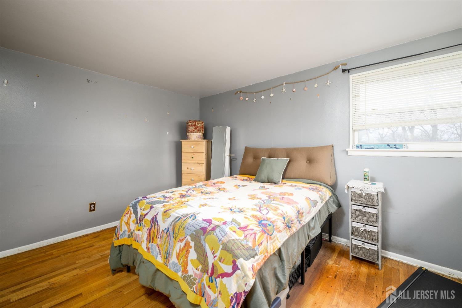 109 Hickory Road Colonia, NJ 07067 - Photo 27 of 34 a bedroom with a bed and window