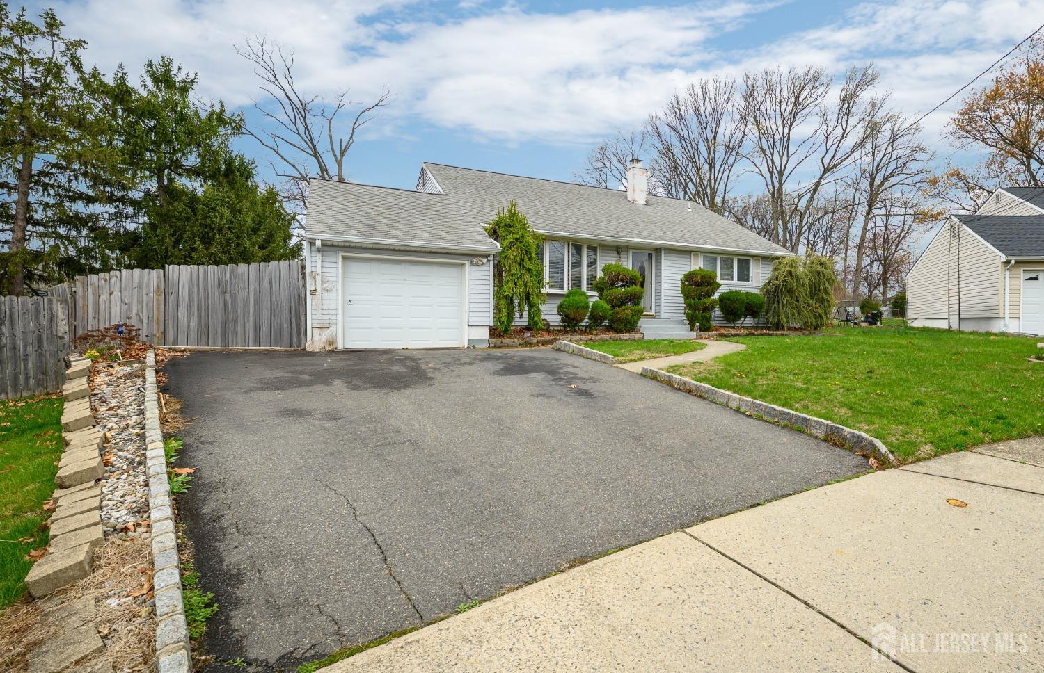 109 Hickory Road Colonia, NJ 07067 - Photo 28 of 34 a backyard of a house with table and chairs
