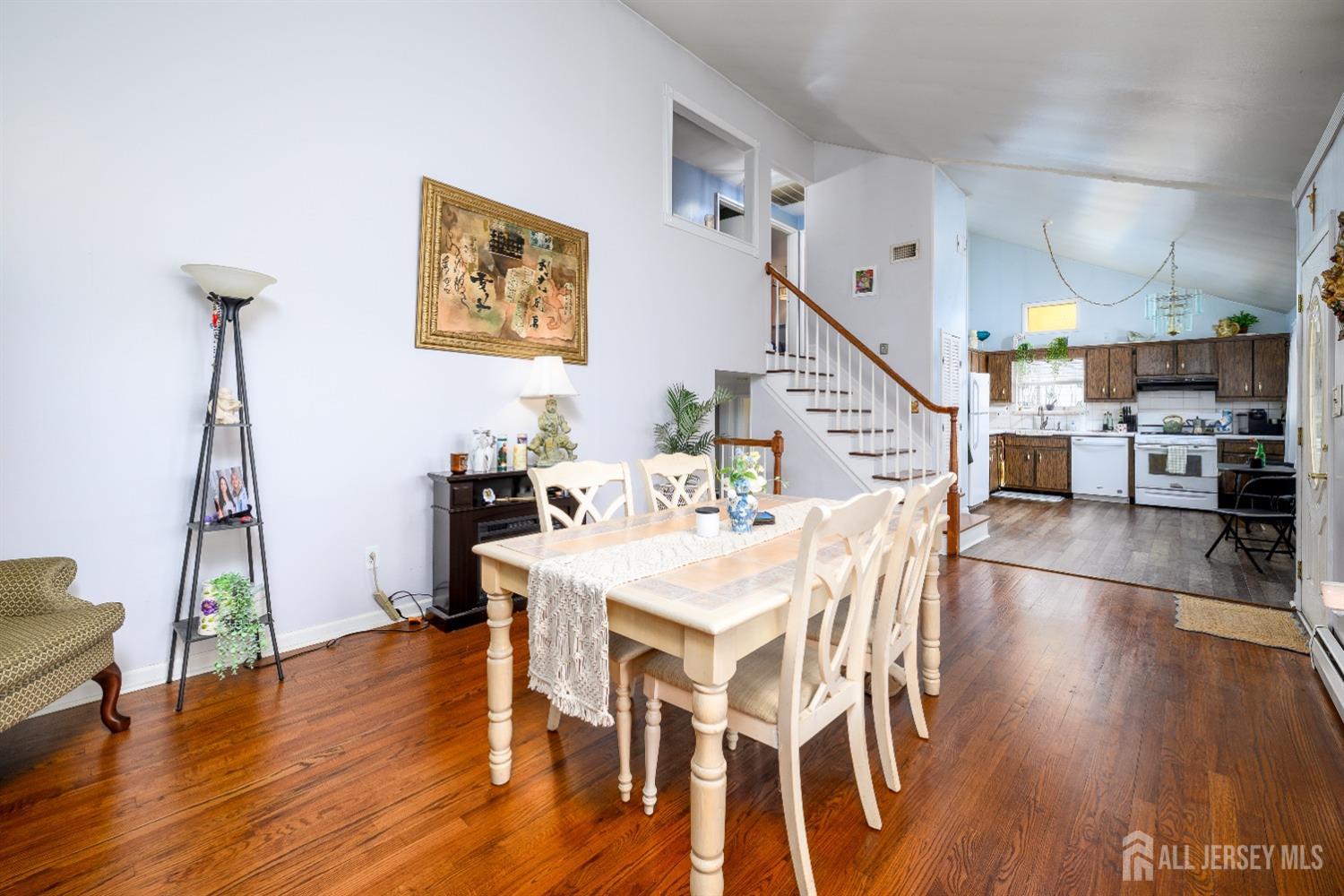 109 Hickory Road Colonia, NJ 07067 - Photo 4 of 34 a view of a dining room with furniture and wooden floor