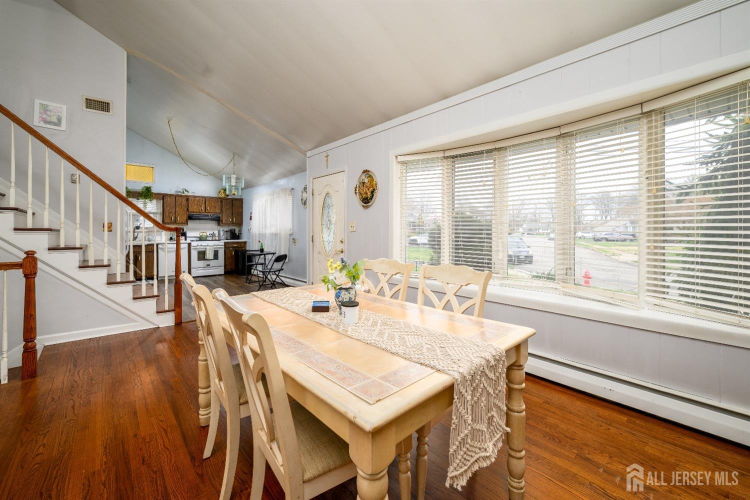109 Hickory Road Colonia, NJ 07067 - Photo 5 of 34 a view of a dining room with furniture window and wooden floor