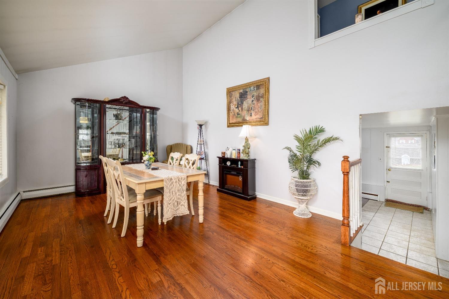 109 Hickory Road Colonia, NJ 07067 - Photo 6 of 34 a dining room with furniture and wooden floor