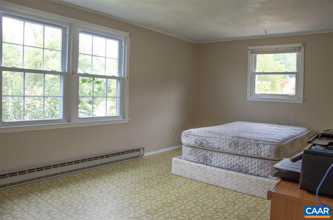 230 Ridge Street Lovingston, VA 22949 - Photo 21 of 37 a room with a bed and a window