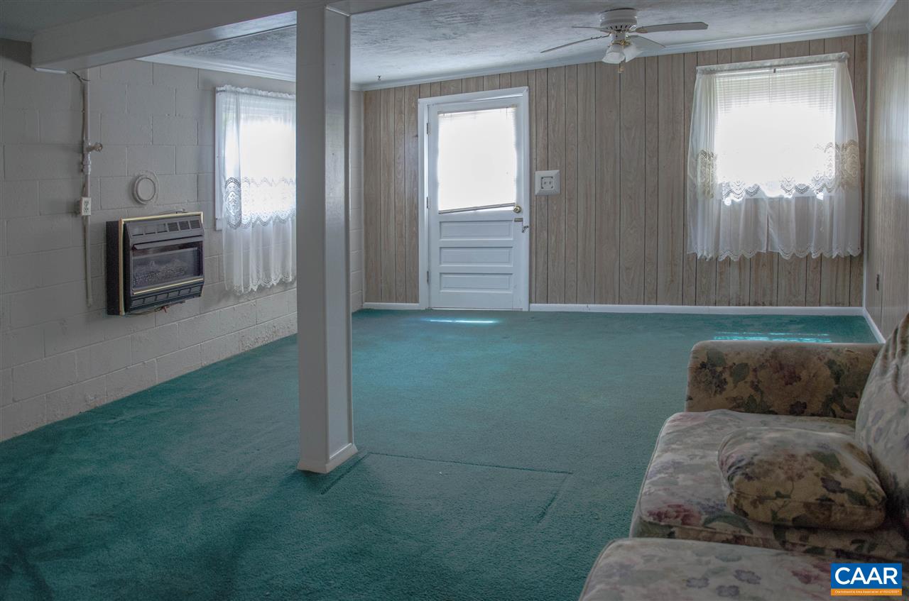 230 Ridge Street Lovingston, VA 22949 - Photo 27 of 37 a living room with furniture and a window