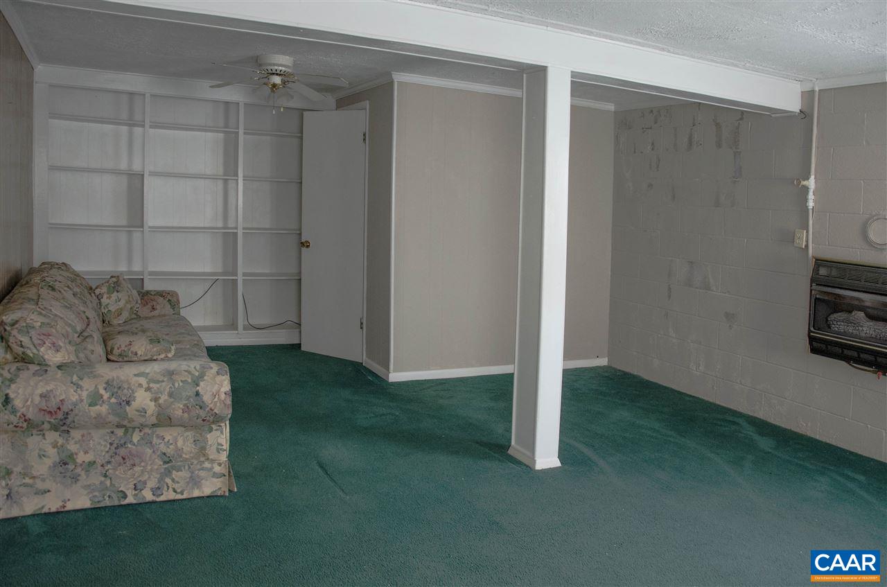 230 Ridge Street Lovingston, VA 22949 - Photo 28 of 37 a living room with furniture and a gate