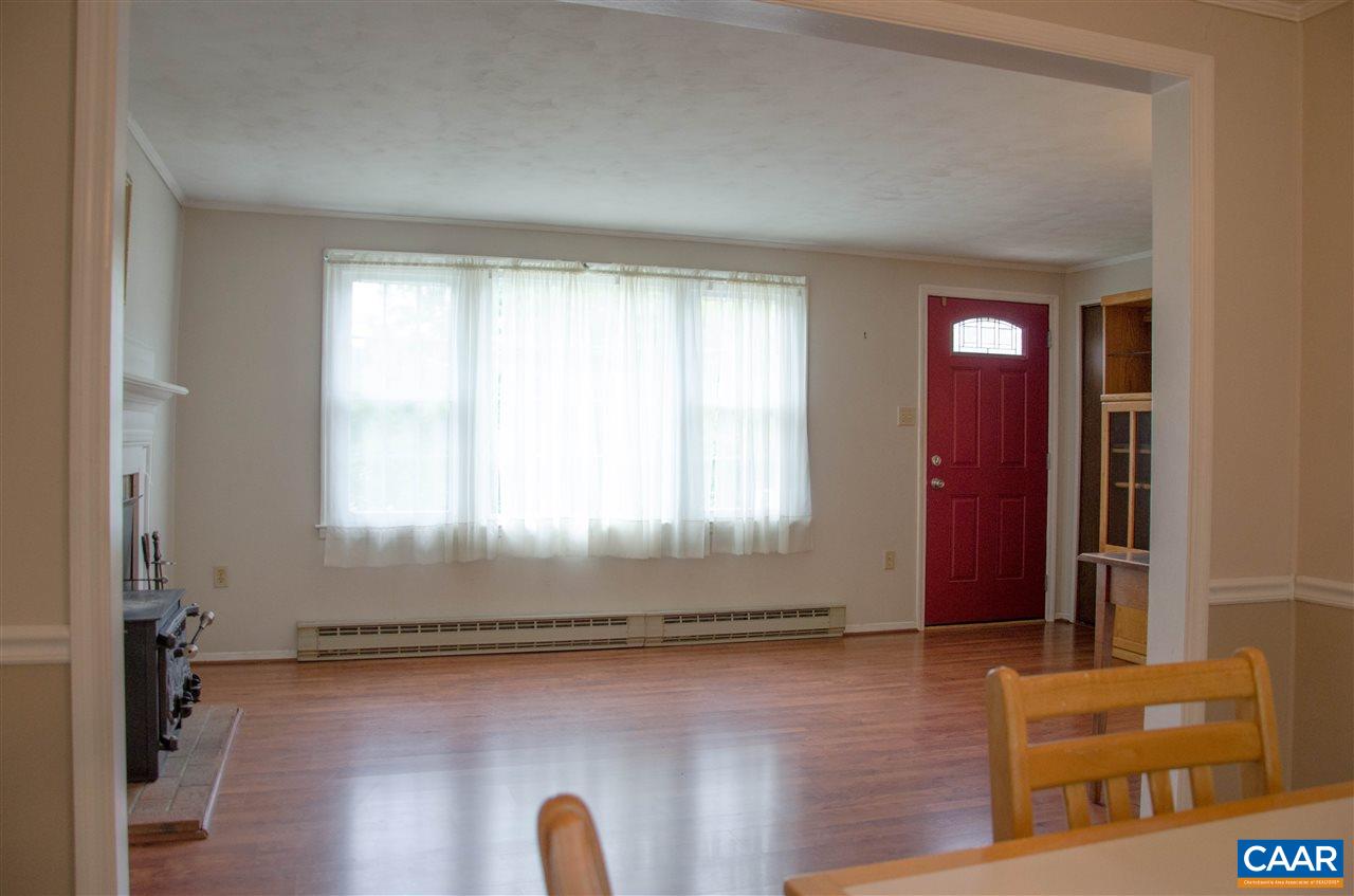 230 Ridge Street Lovingston, VA 22949 - Photo 4 of 37 a room with a door open to a room