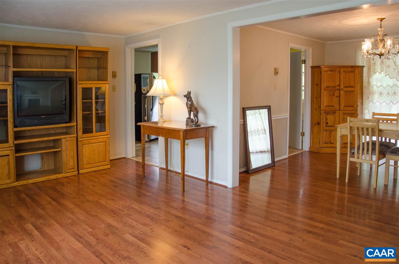 230 Ridge Street Lovingston, VA 22949 - Photo 5 of 37 a view of empty room with wooden floor and furniture