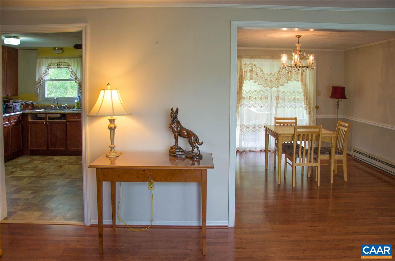 230 Ridge Street Lovingston, VA 22949 - Photo 9 of 37 a view of a dining room with furniture and chandelier