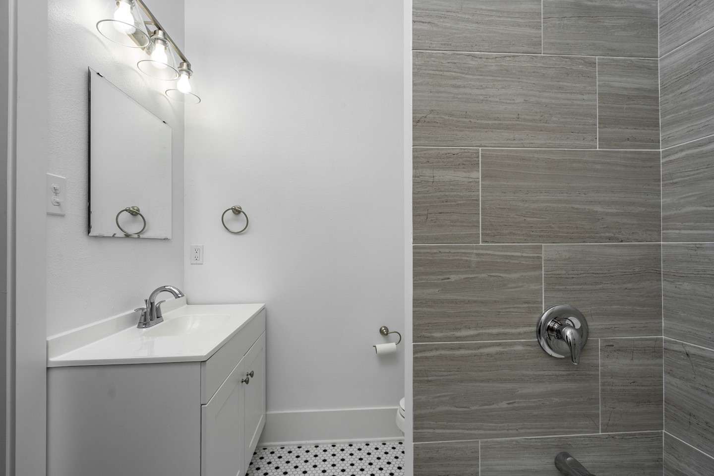 2311 Lee Street Houston, TX 77026 - Photo 11 of 24 a bathroom with a sink a toilet and shower