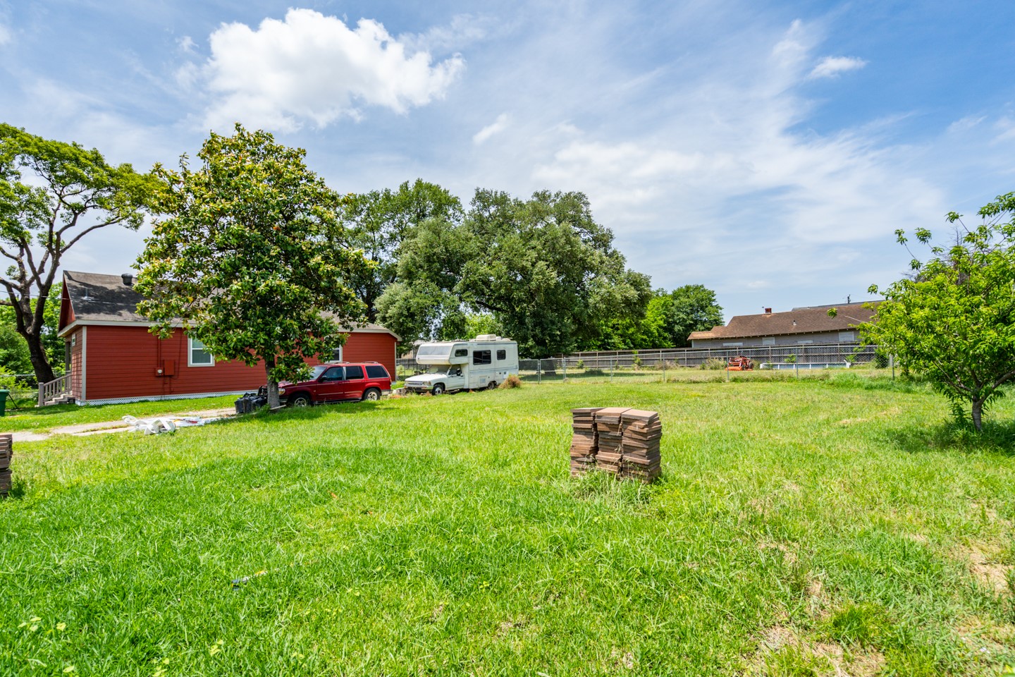 2311 Lee Street Houston, TX 77026 - Photo 21 of 24 a garden with trees in the background