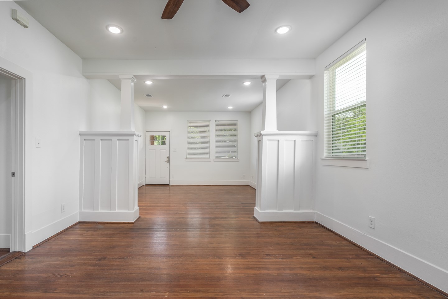 2311 Lee Street Houston, TX 77026 - Photo 4 of 24 a view of an empty room with wooden floor and a window