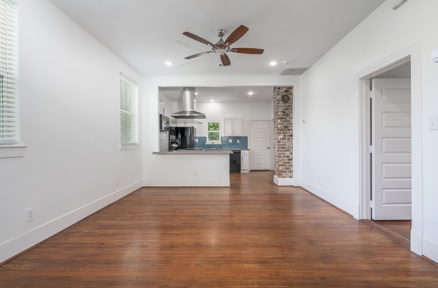 2311 Lee Street Houston, TX 77026 - Photo 5 of 24 a view of kitchen with microwave and wooden floor