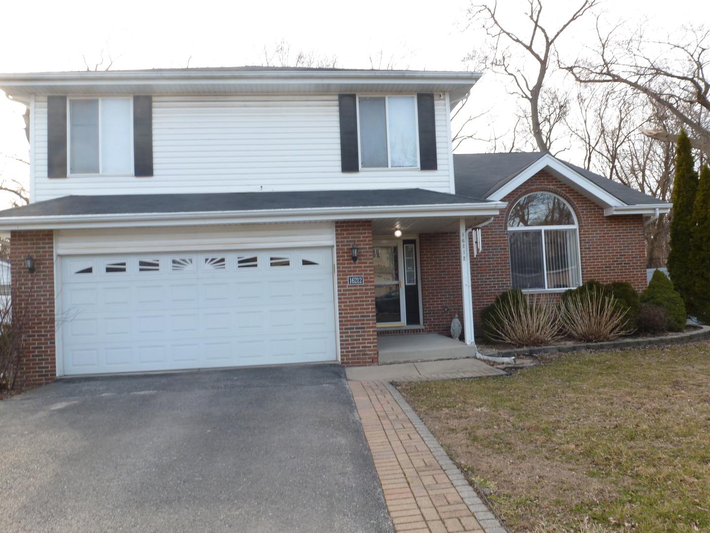 front view of a house with a yard
