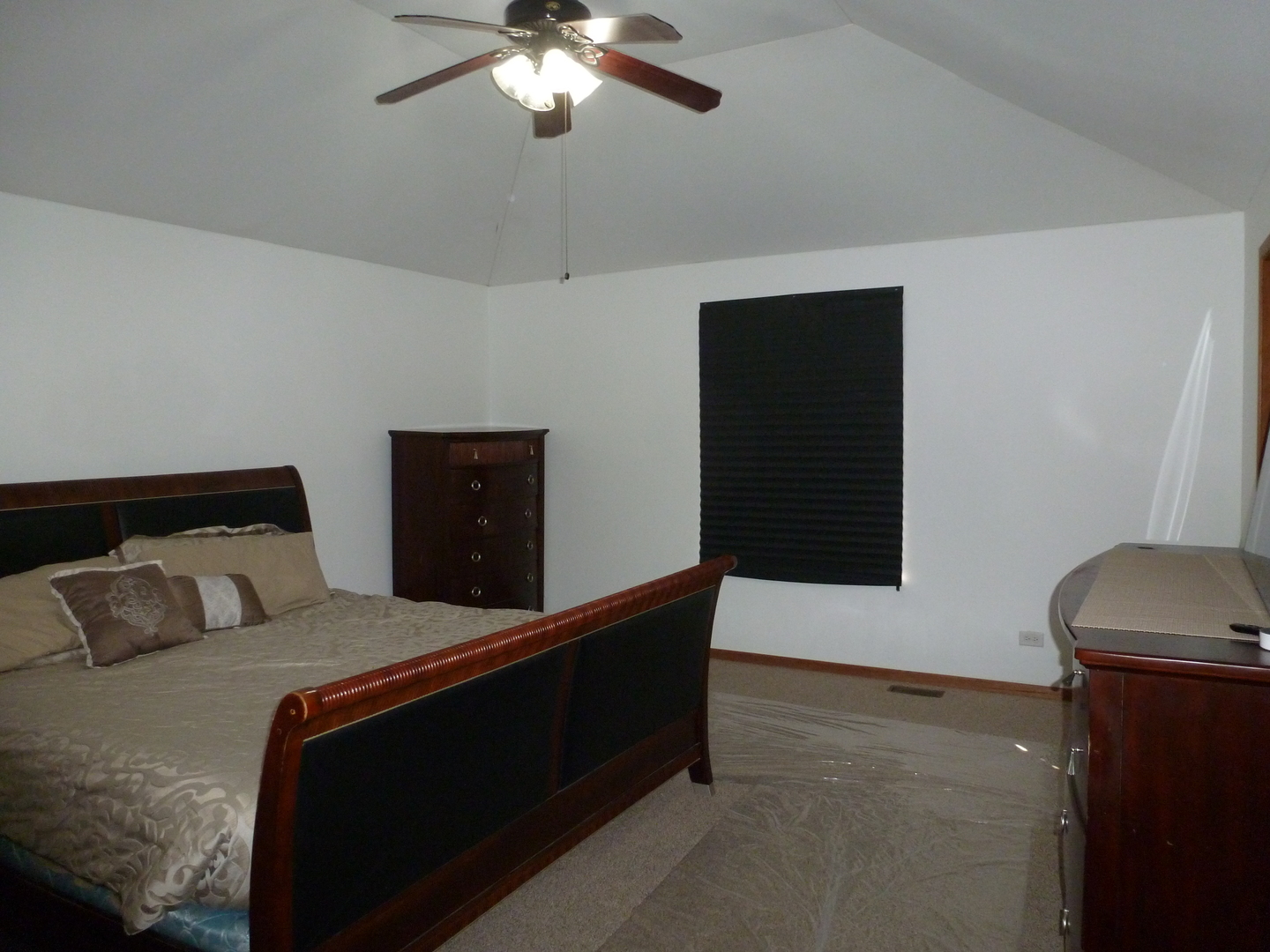 16212 Trumbull Avenue Markham, IL 60428 - Photo 15 of 36 a bedroom with a bed and a ceiling fan