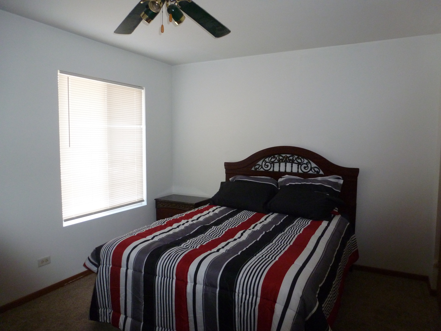 16212 Trumbull Avenue Markham, IL 60428 - Photo 21 of 36 a bedroom with a bed and a window