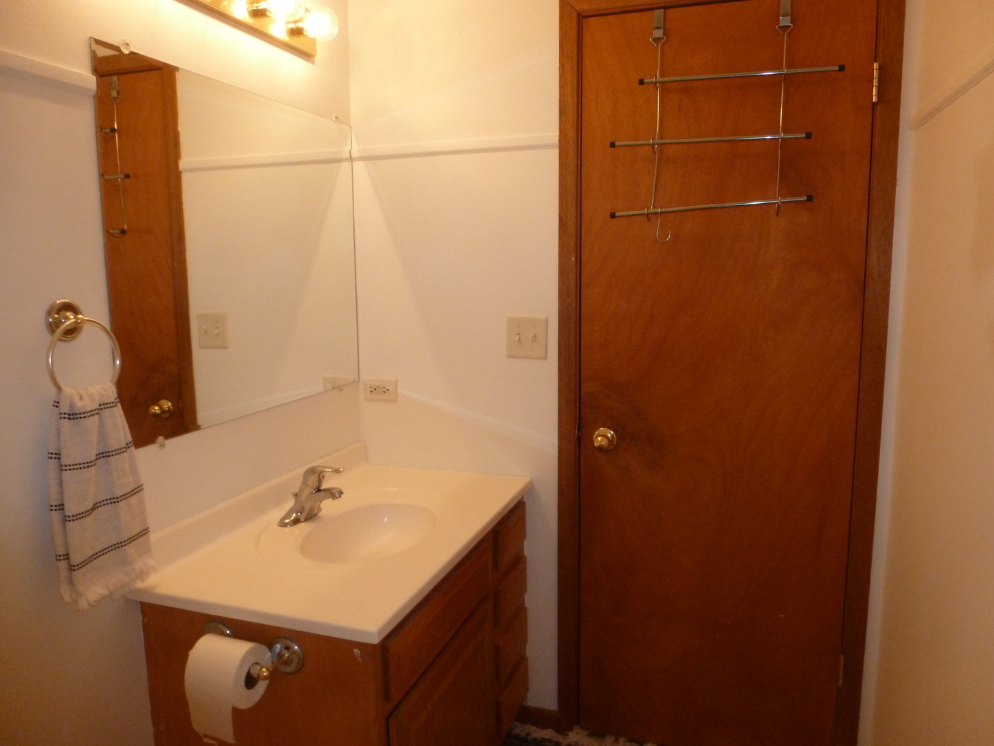 16212 Trumbull Avenue Markham, IL 60428 - Photo 24 of 36 a bathroom with a sink and mirror