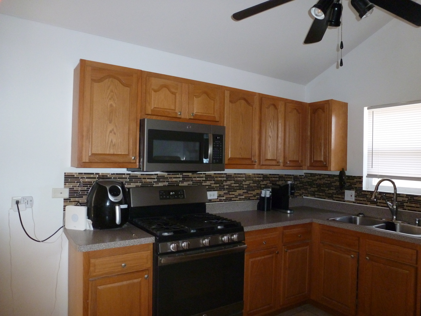 16212 Trumbull Avenue Markham, IL 60428 - Photo 27 of 36 a kitchen with a sink appliances and cabinets