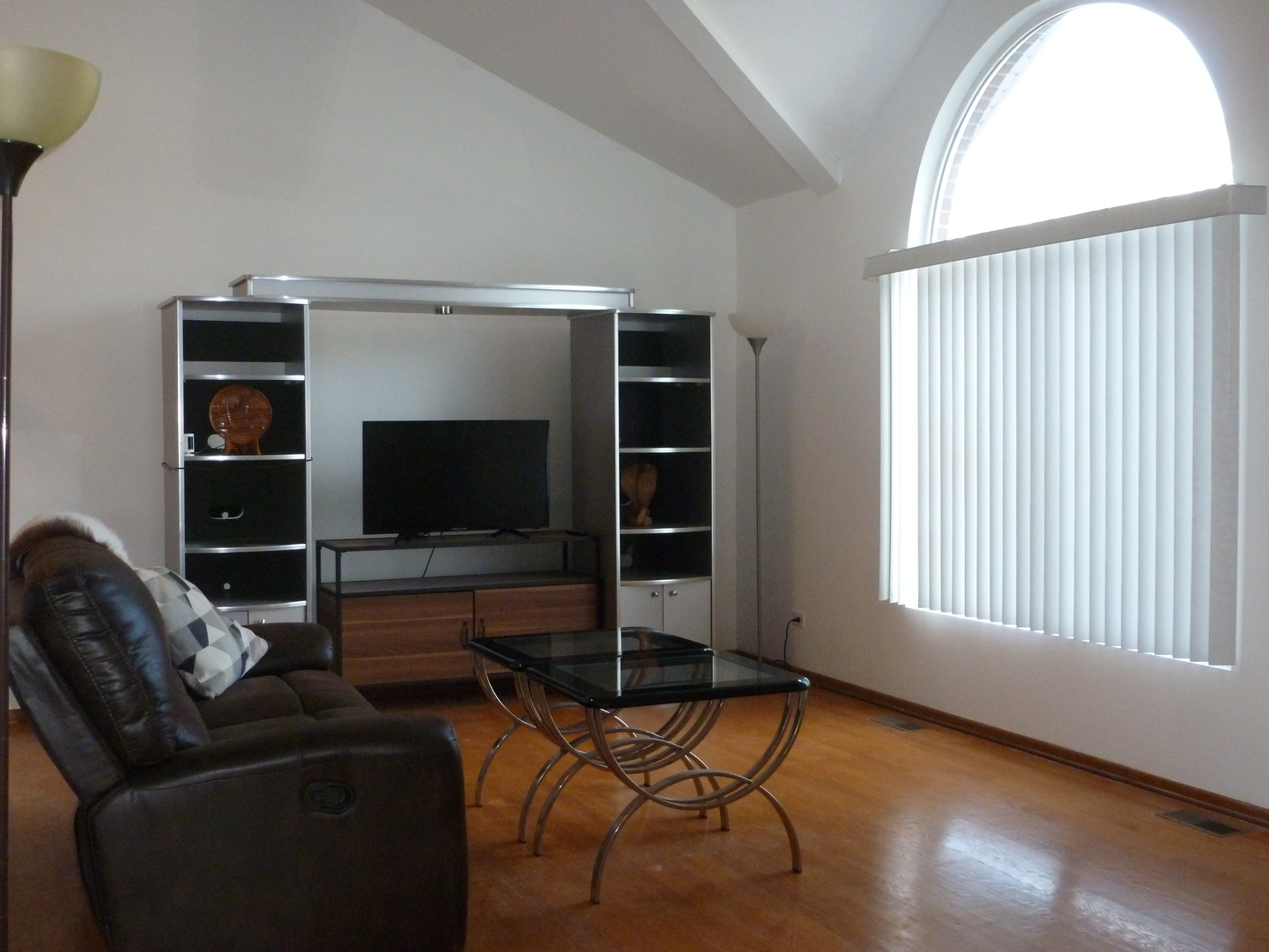 16212 Trumbull Avenue Markham, IL 60428 - Photo 4 of 36 a living room with furniture and a flat screen tv