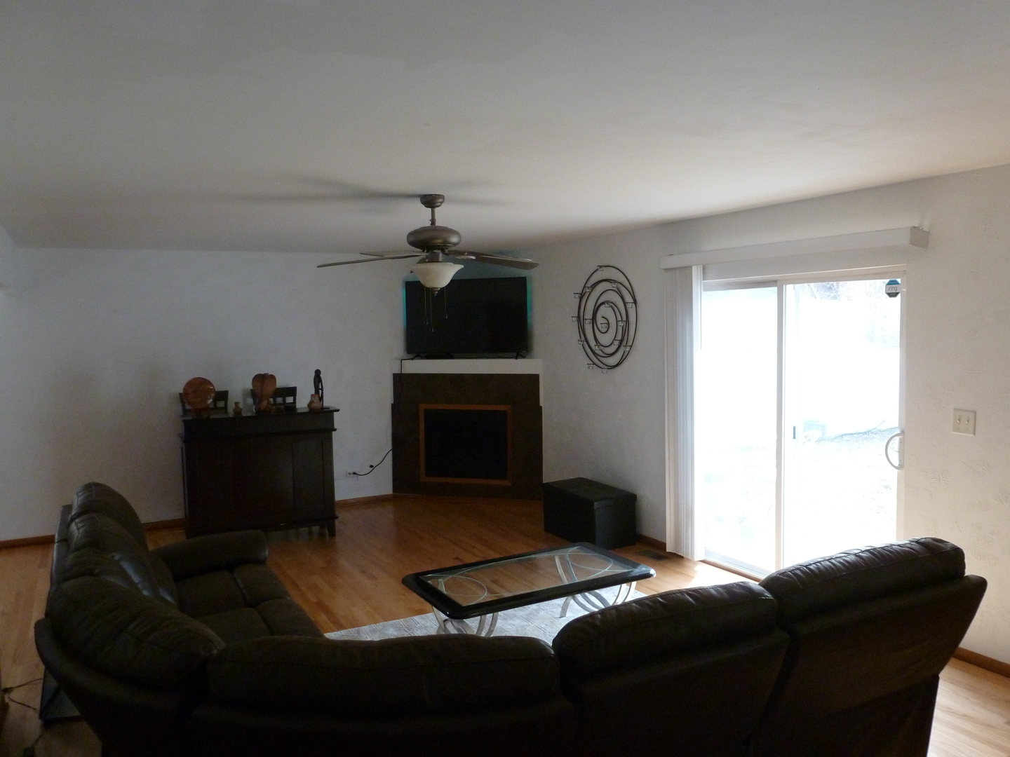 16212 Trumbull Avenue Markham, IL 60428 - Photo 7 of 36 a living room with furniture a fireplace and a window