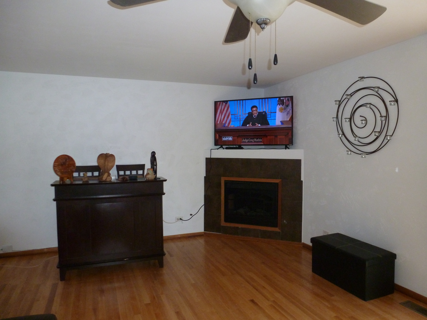 16212 Trumbull Avenue Markham, IL 60428 - Photo 8 of 36 a living room with furniture and a fireplace
