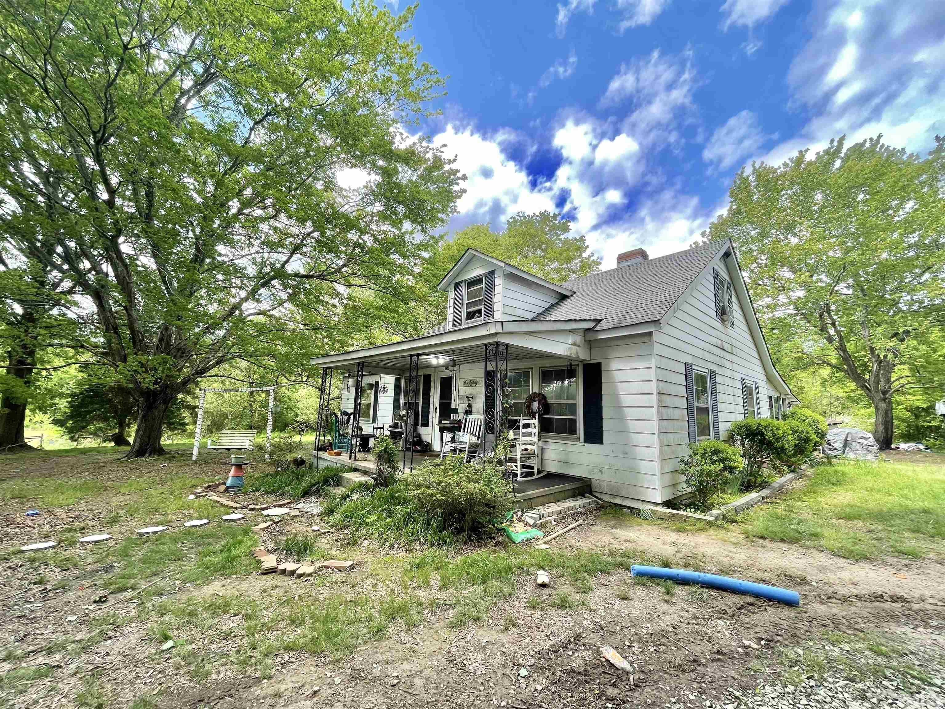 755 Kermit Duncan Road Timberlake, NC 27583 - Photo 1 of 19 a front view of house with a garden