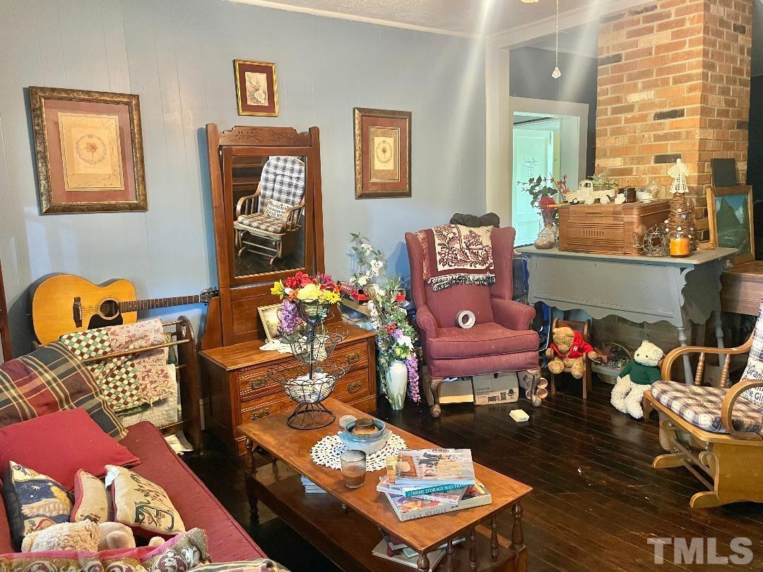 755 Kermit Duncan Road Timberlake, NC 27583 - Photo 8 of 19 a living room with furniture and wooden floor