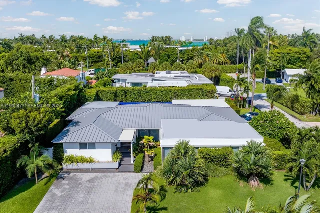 a aerial view of a house with a garden and plants