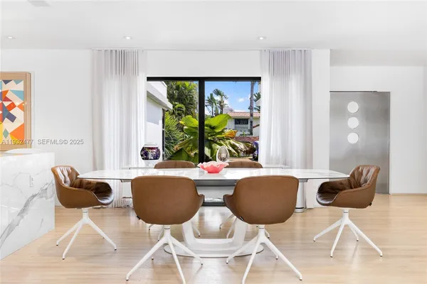 a bedroom with a large bed and a large window