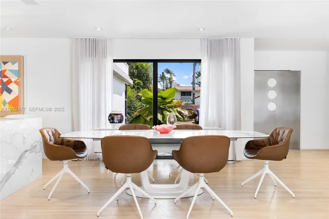 a bedroom with a large bed and a large window