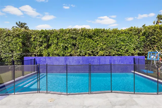 a view of a house with backyard and balcony