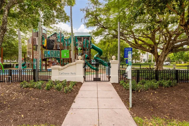 a view of a park with swings and slides
