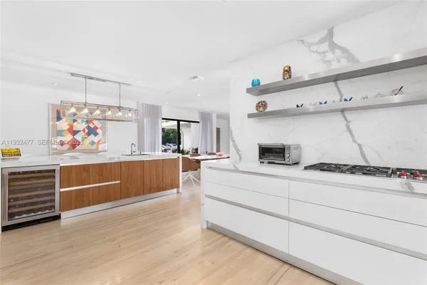 a view of a kitchen with a sink